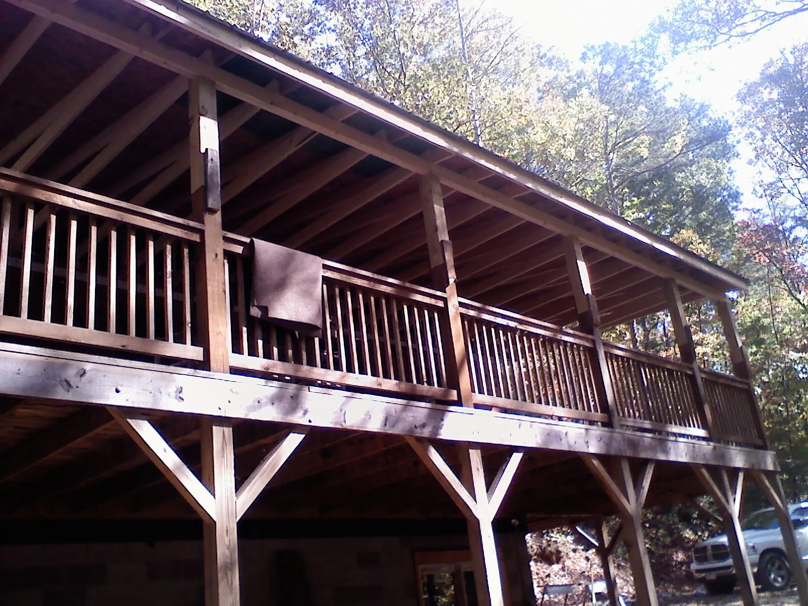 Timber framing under a new elevated porch and deck — Roof Leak Repair in West Harrison by Roofing Brothers